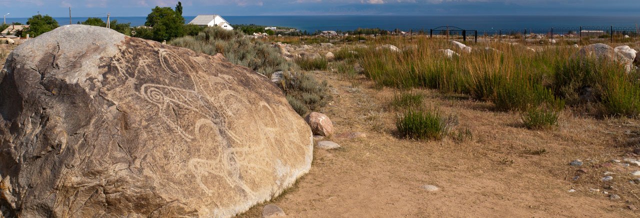 Petroglyph site in Cholpon Ata with lake Issyk Kul in the background